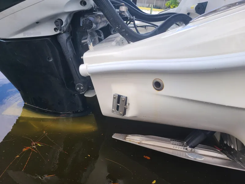 Slide: The Image of Close-up of a 2009 Glasstream 360 SCX boat engine in water. - 32