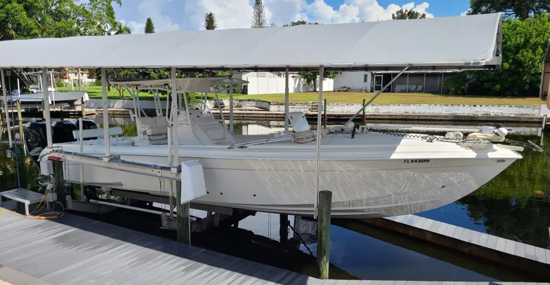Slide: The Image of 2009 Glasstream 360 SCX boat docked under a canopy. - 6