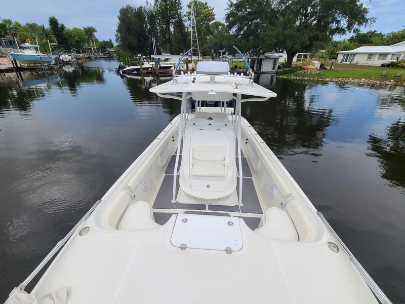 Slide: The Image of 2009 Glasstream 360 SCX boat docked in a serene waterfront setting. - 8