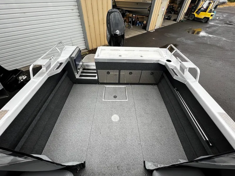 Slide: The Image of 2024 Thunder Jet 200 Luxor boat interior with spacious deck and storage compartments. - 14