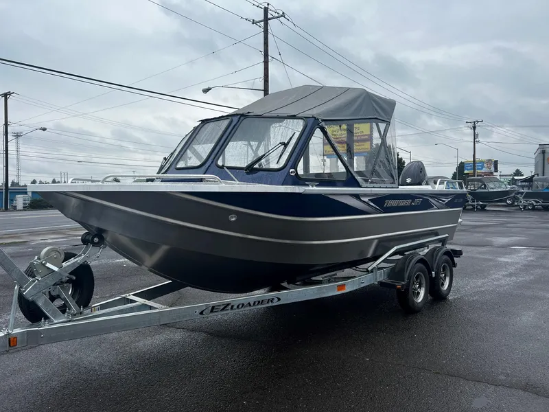 Slide: The Image of 2024 Thunder Jet 200 Luxor boat on trailer in parking lot. - 7