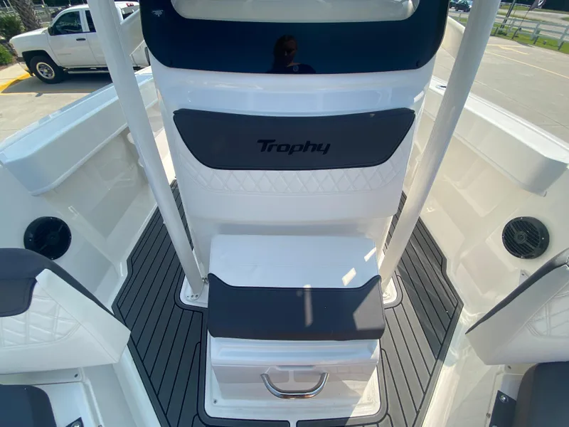 Slide: The Image of 2024 Bayliner Trophy 20 CC center console boat interior with cushioned seating. - 15