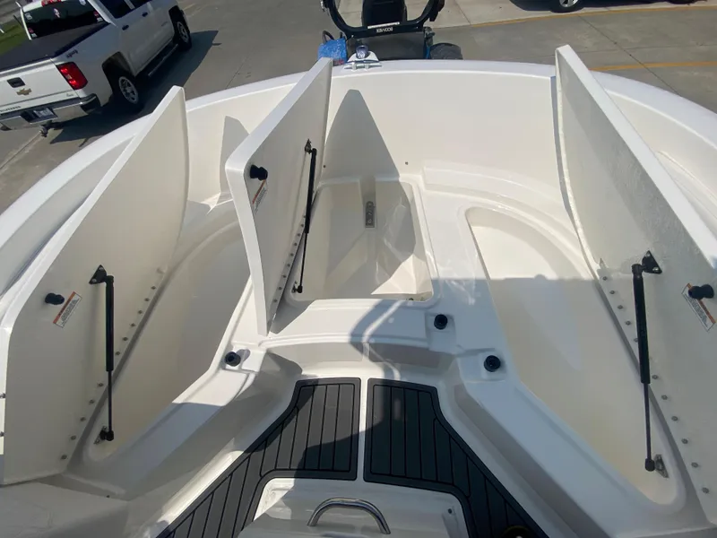 Slide: The Image of 2024 Bayliner Trophy 20 CC boat with open storage compartments. - 17