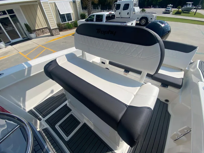 Slide: The Image of 2024 Bayliner Trophy 20 CC boat interior with cushioned seating and modern design. - 11