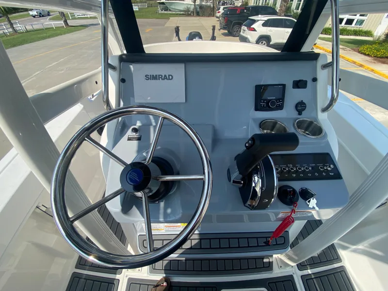 Slide: The Image of 2024 Bayliner Trophy 20 CC helm with Simrad electronics and modern controls. - 12