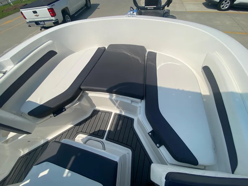 Slide: The Image of 2024 Bayliner Trophy 20 CC boat interior with cushioned seating. - 18