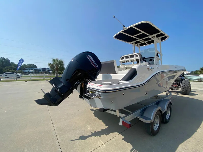 Slide: The Image of 2024 Bayliner Trophy 20 CC boat on trailer with outboard motor. - 2