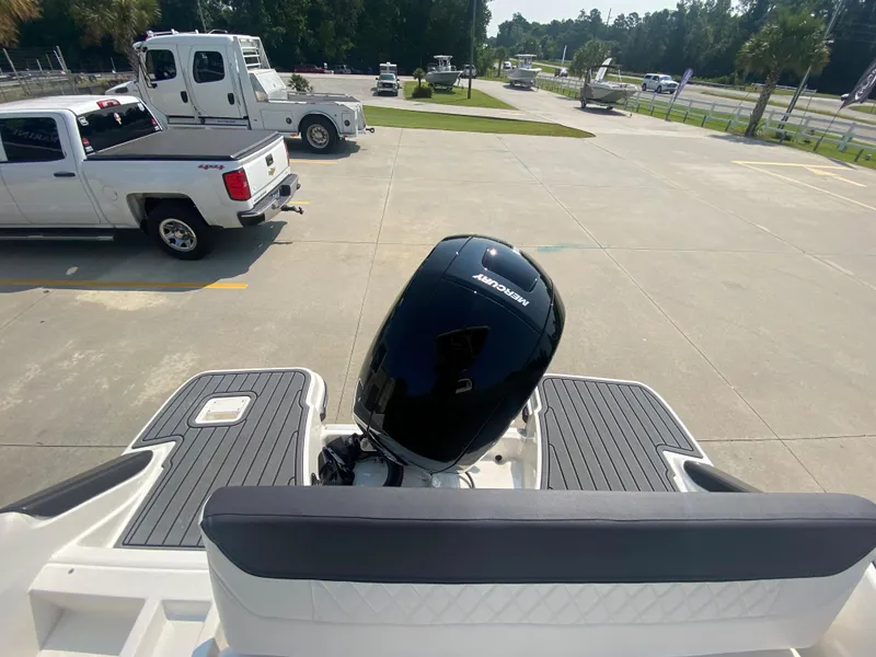 Slide: The Image of 2024 Bayliner Trophy 20 CC with Mercury outboard motor in parking lot. - 6