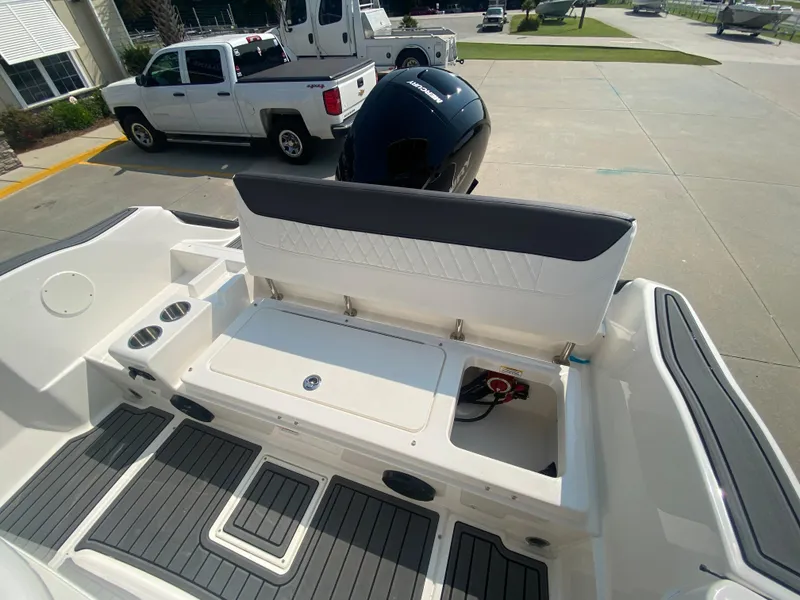 Slide: The Image of 2024 Bayliner Trophy 20 CC boat interior with seating and storage compartments. - 8