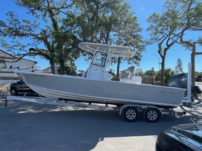Slide: The Image of 2021 Sportsman Masters 267OE Bay Boat on a trailer in a sunny outdoor setting. - 12