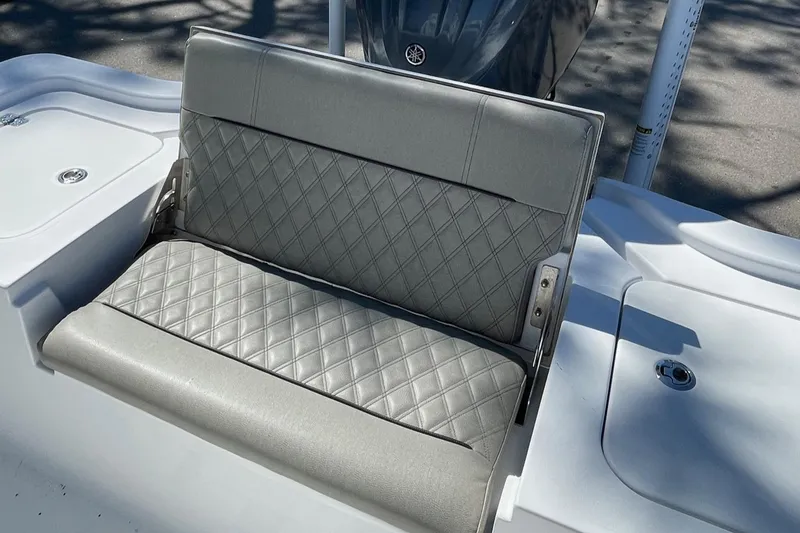 Slide: The Image of 2021 Sportsman Masters 267OE Bay Boat, gray cushioned seating with diamond stitching. - 16