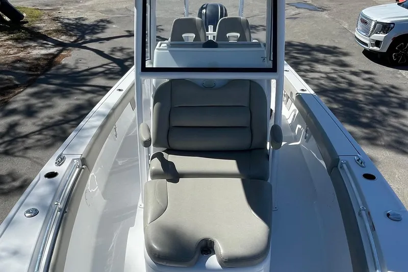 Slide: The Image of 2021 Sportsman Masters 267OE Bay Boat with cushioned seating and center console. - 18