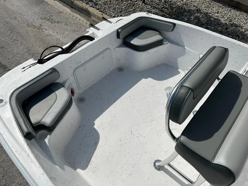 Slide: The Image of 2024 ALK2 Powerboats 22 CRS interior seating area with gray cushions. - 12