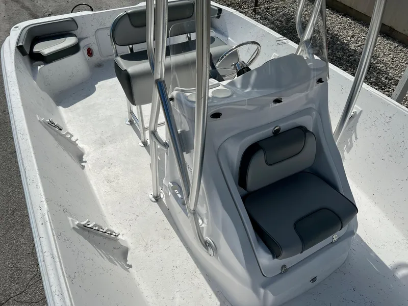 Slide: The Image of 2024 ALK2 Powerboats 22 CRS interior with seating and steering console. - 14