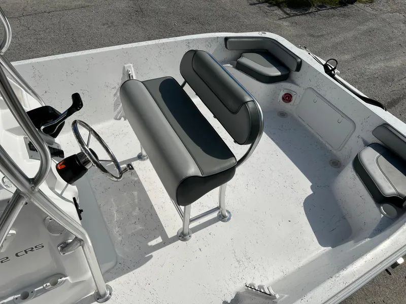 Slide: The Image of 2024 ALK2 Powerboats 22 CRS interior with seating and steering wheel. - 18