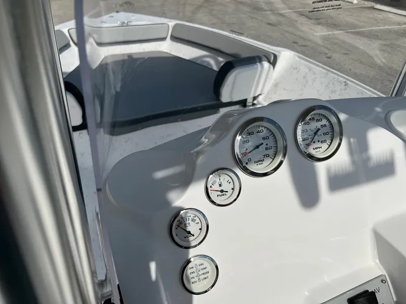 Slide: The Image of 2024 ALK2 Powerboats 22 CRS dashboard with gauges and seating area. - 19