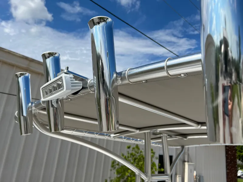 Slide: The Image of Close-up of 2024 ALK2 Powerboats 22 CRS rod holders and canopy. - 20