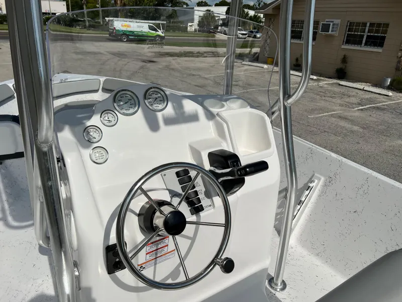 Slide: The Image of 2024 ALK2 Powerboats 22 CRS console with steering wheel and gauges. - 23