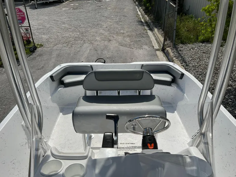 Slide: The Image of 2024 ALK2 Powerboats 22 CRS interior with steering wheel and seating. - 24