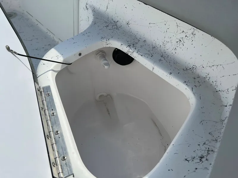 Slide: The Image of 2024 ALK2 Powerboats 22 CRS livewell compartment with white interior. - 25