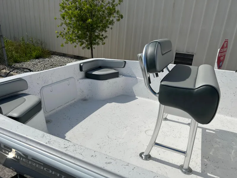 Slide: The Image of 2024 ALK2 Powerboats 22 CRS interior with seating and console. - 5
