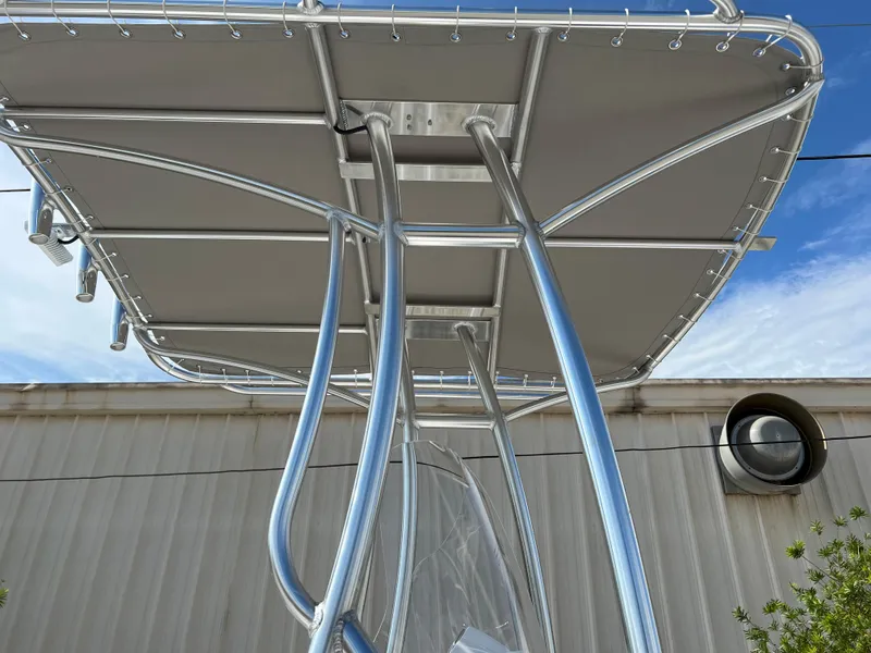 Slide: The Image of 2024 ALK2 Powerboats 22 CRS T-top frame and canopy against blue sky. - 7