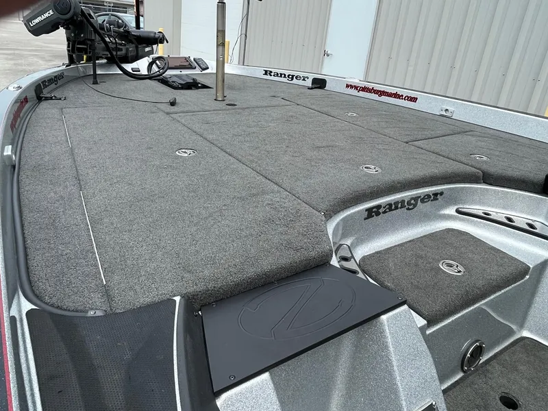 Slide: The Image of 2016 Ranger Z520C fishing boat deck with storage compartments and trolling motor. - 5