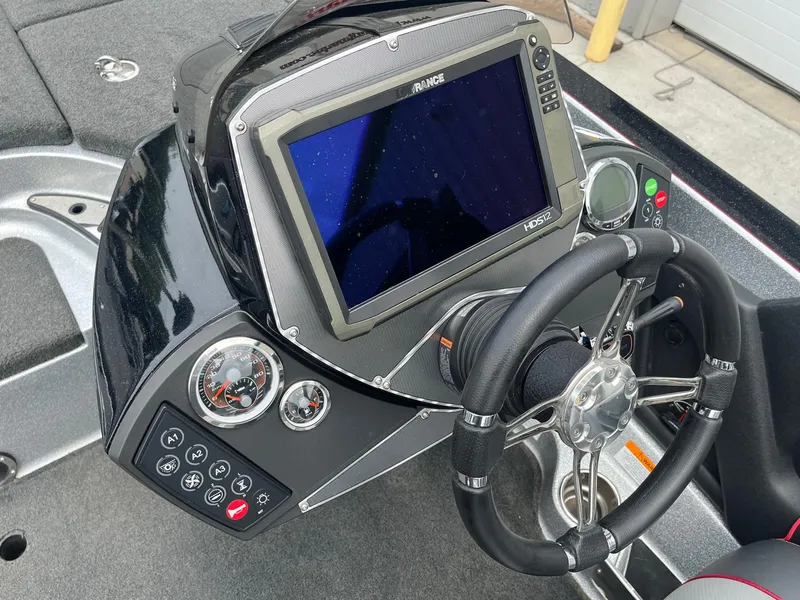 Slide: The Image of 2016 Ranger Z520C boat dashboard with steering wheel and electronic display. - 8