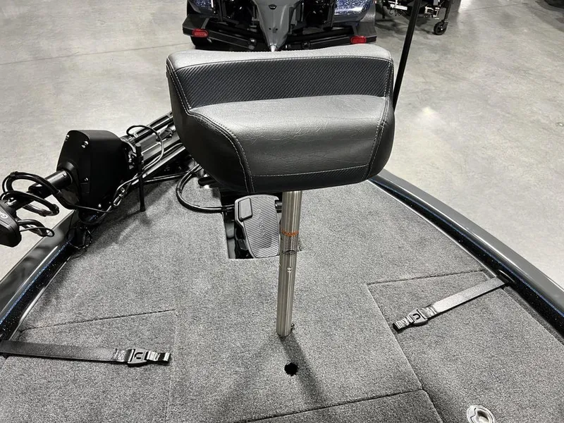Slide: The Image of 2024 Phoenix 920 Elite boat seat and deck with fishing equipment. - 11