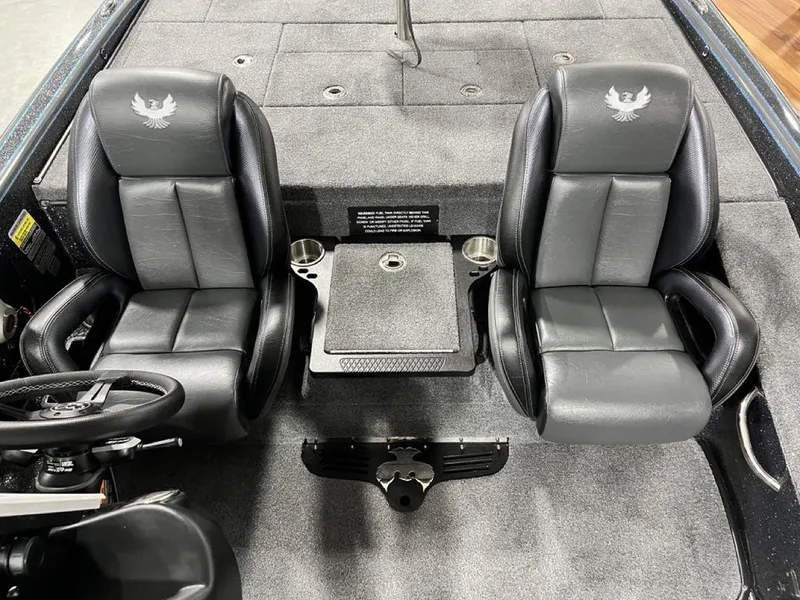 Slide: The Image of 2024 Phoenix 920 Elite boat interior with dual black leather seats. - 18