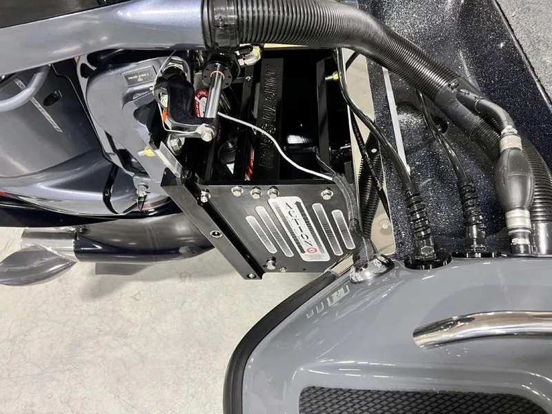 Slide: The Image of 2024 Phoenix 920 Elite boat engine compartment with wiring and battery. - 26