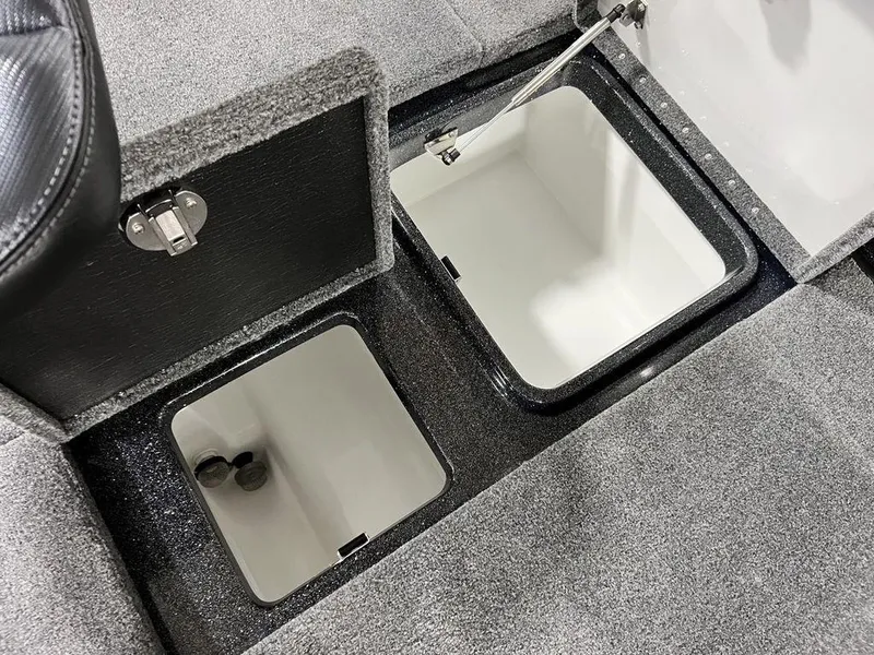 Slide: The Image of 2024 Phoenix 920 Elite storage compartments with open lids. - 28