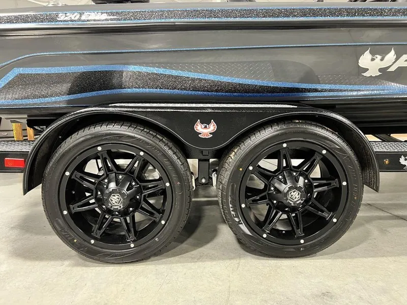 Slide: The Image of 2024 Phoenix 920 Elite boat trailer with black alloy wheels. - 4