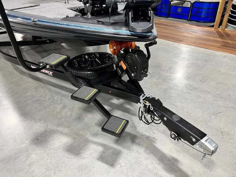 Slide: The Image of 2024 Phoenix 920 Elite boat trailer with steps and spare tire. - 5