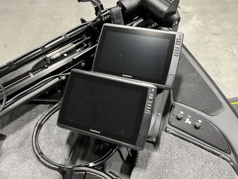 Slide: The Image of Dual Garmin screens on Phoenix 920 Elite 2024 boat dashboard. - 7