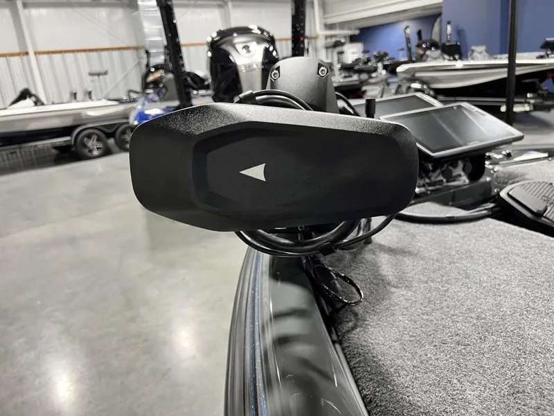 Slide: The Image of 2024 Phoenix 920 Elite boat with advanced navigation system in a showroom. - 9