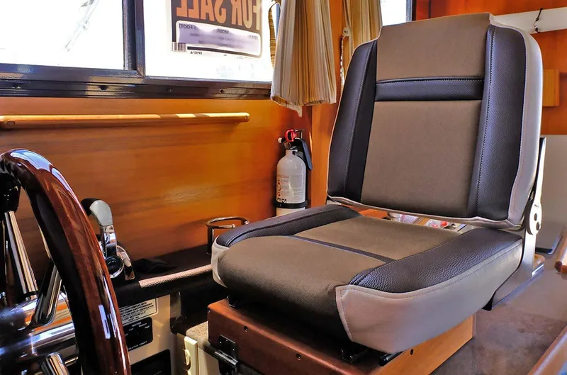 Slide: The Image of Captain's chair in 2014 Ranger Tugs R-25 SC boat interior. - 4
