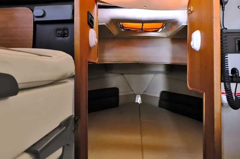 Slide: The Image of 2014 Ranger Tugs R-25 SC cabin interior with cozy sleeping area. - 5