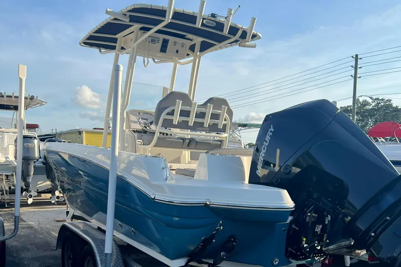 Slide: The Image of 2020 Stingray 216 CC boat with Mercury outboard motor on trailer. - 11