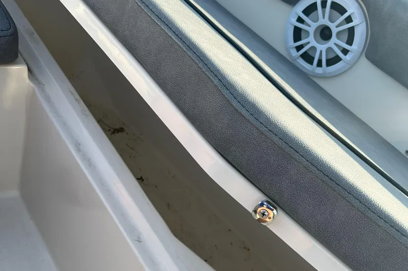 Slide: The Image of Stingray 216 CC 2020 boat interior storage compartment with speaker. - 16