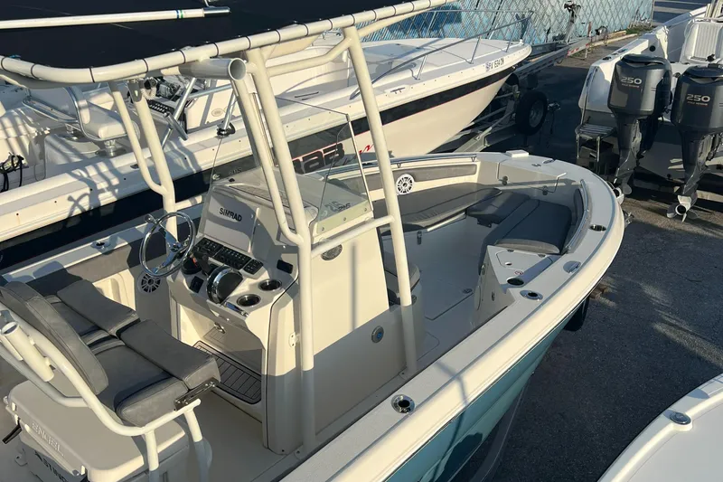 Slide: The Image of 2020 Stingray 216 CC center console boat docked in marina. - 21