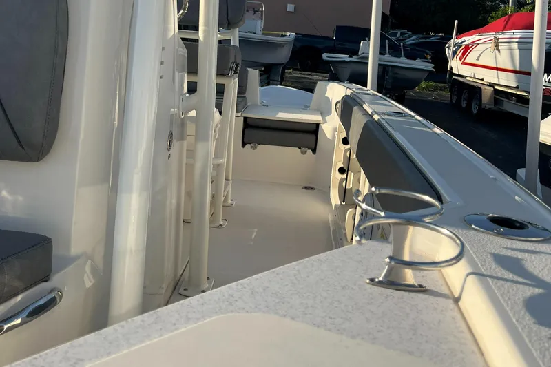 Slide: The Image of 2020 Stingray 216 CC boat interior with seating and rod holders. - 28