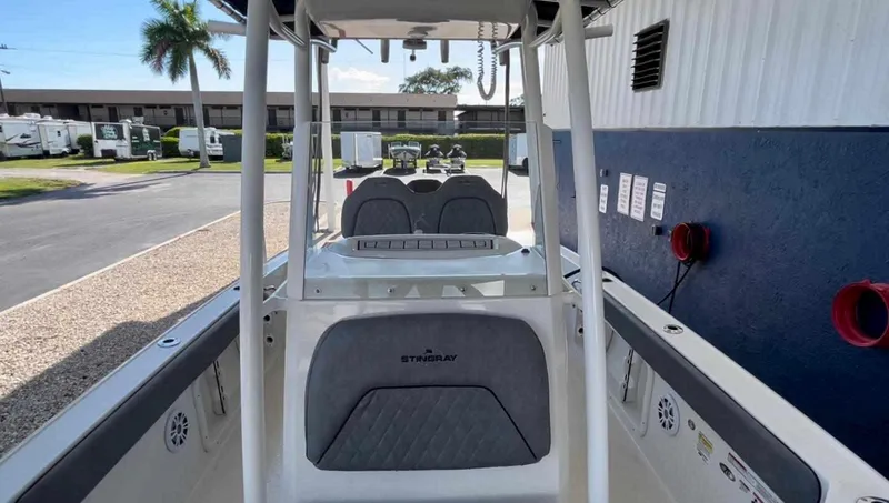 Slide: The Image of 2020 Stingray 216 CC boat interior with seating and console. - 38
