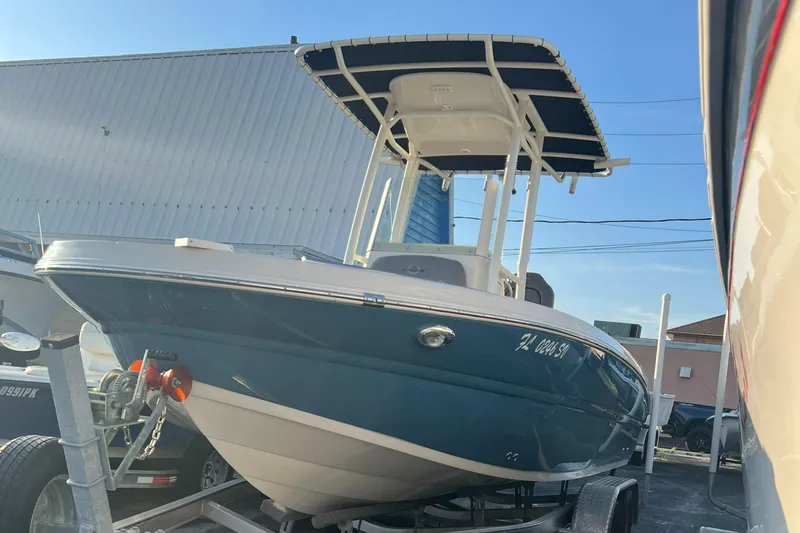 Slide: The Image of 2020 Stingray 216 CC boat on trailer in marina. - 5