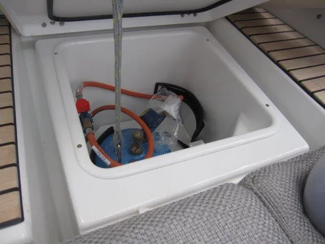 Slide: The Image of Storage compartment on 2024 Jeanneau 55 yacht with equipment and hoses. - 10