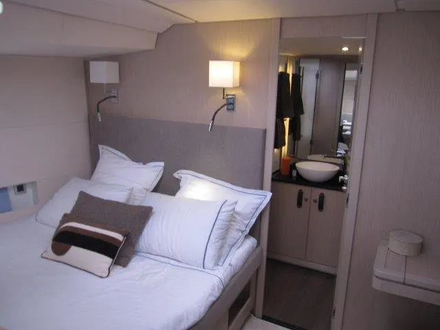 Slide: The Image of Luxurious bedroom interior of 2024 Jeanneau 55 yacht with ensuite bathroom. - 15