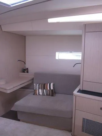 Slide: The Image of Modern interior of 2024 Jeanneau 55 yacht with cozy seating area. - 17
