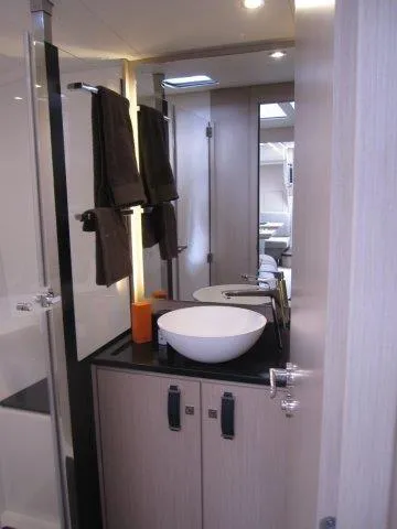 Slide: The Image of Modern bathroom in 2024 Jeanneau 55 yacht with vessel sink and sleek design. - 19
