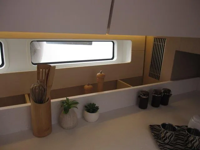Slide: The Image of Modern kitchen interior of Jeanneau 55 yacht, 2024 model, featuring sleek design and natural light. - 31