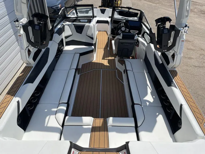 Slide: The Image of 2023 Nautique Super Air Nautique S25 interior with spacious seating and modern design. - 3